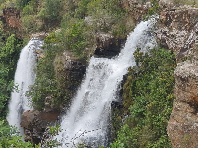 A photo of the Lisbon Falls with rough foaming water